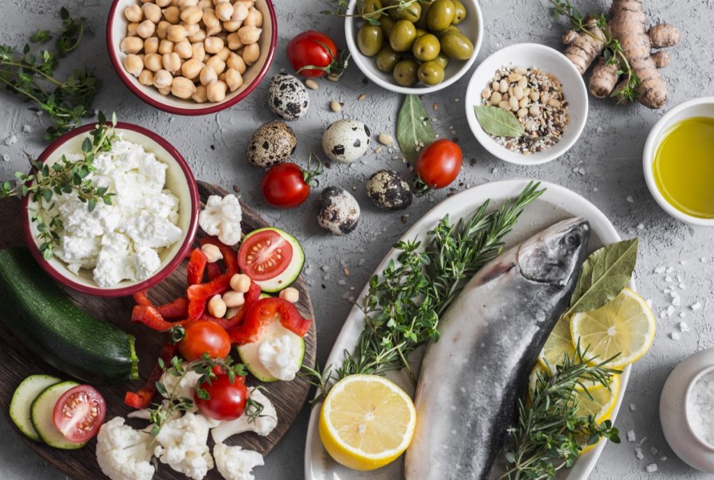 mediterranean diet, mediterranean style food on a table, fish, nuts, olives