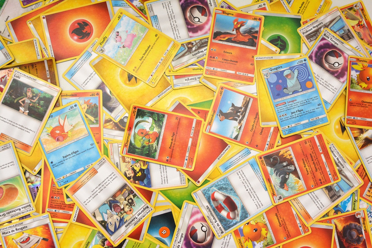 Florianopolis - Brazil, june 13, 2019: Pokemon cards distributed on the white table. Brazilian youths perform battles using these collectible cards.