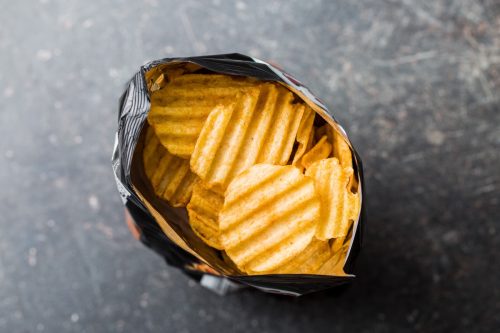 bag of open ruffled potato chips