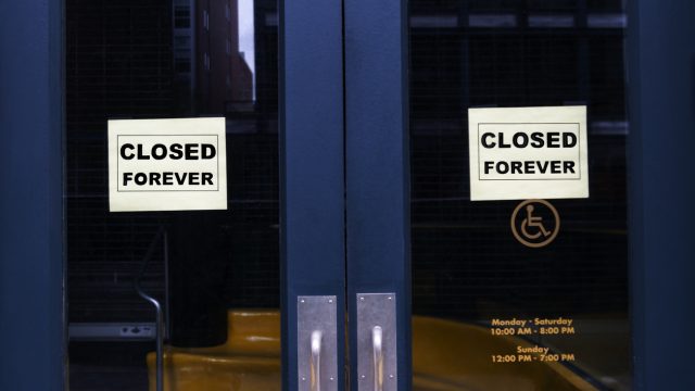 A store with "closed forever" signs hanging in the front doors