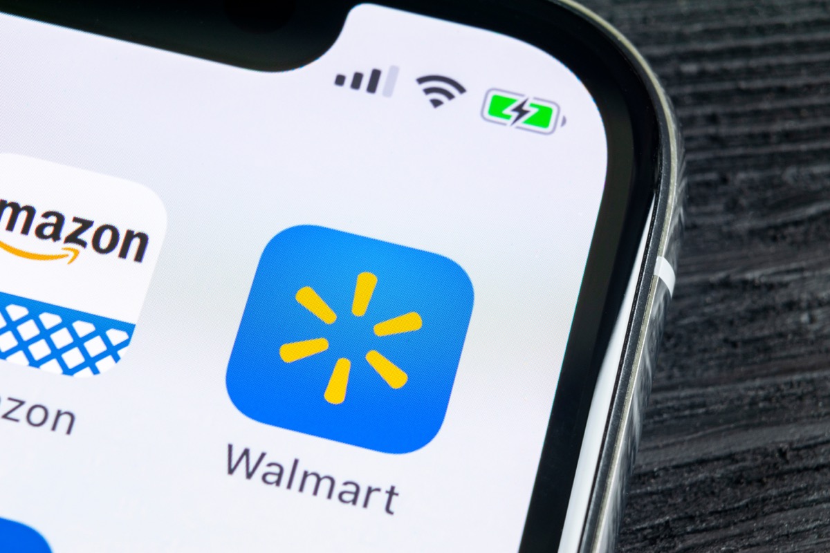 Walmart application icon on Apple iPhone X screen close-up. 