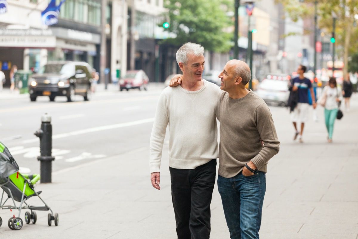 Two men on city walking date