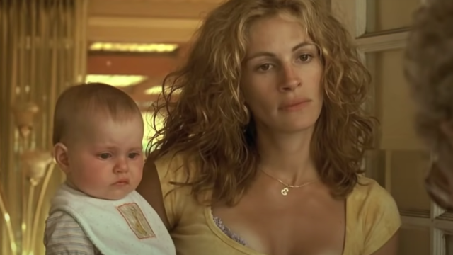 Julia Roberts holding a baby in "Erin Brockovich"