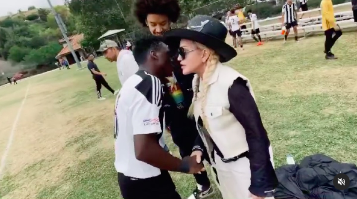 Madonna with son David and boyfriend Ahlamalik Williams at a soccer game