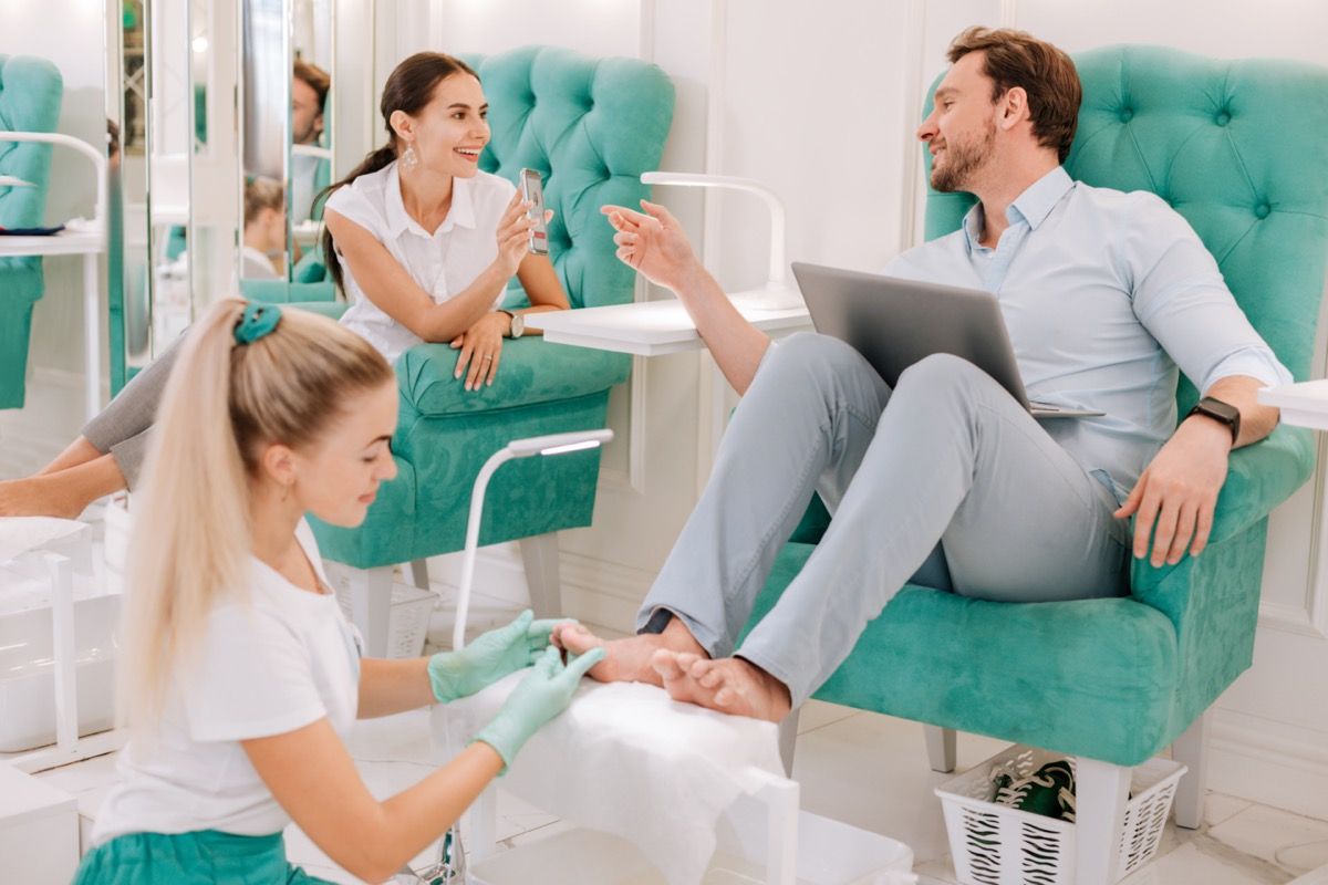 Man and woman getting pedicures