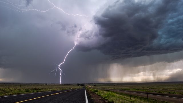 Lightning and thunderstorm over highway