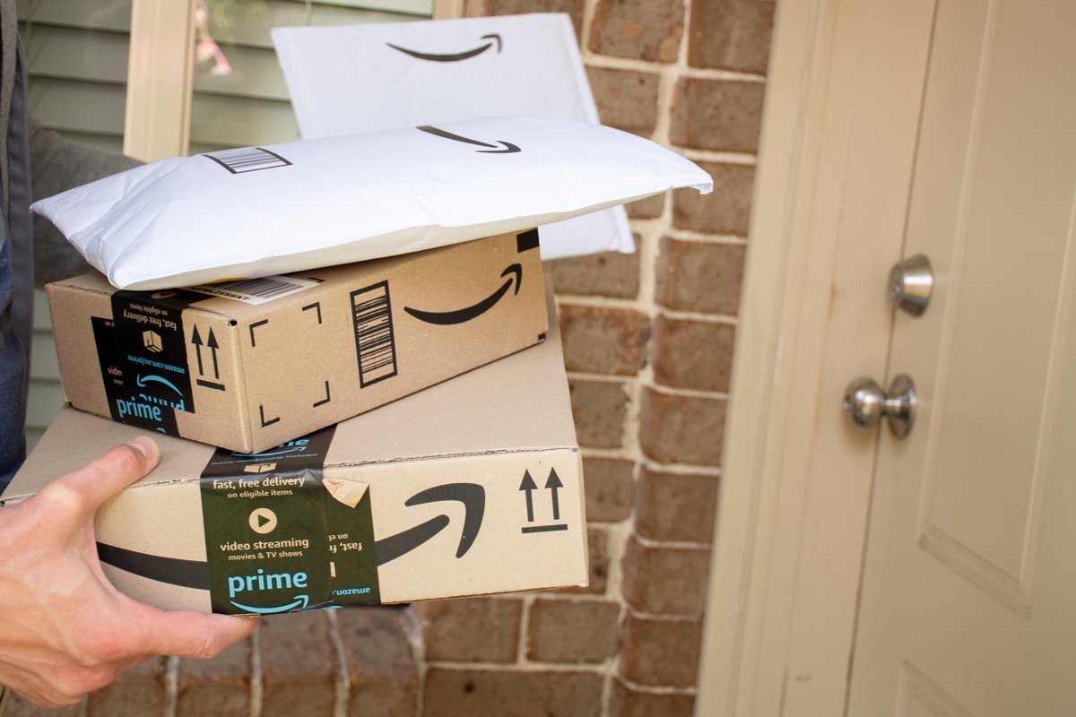 Sydney, Australia - 2020-10-17 Amazon prime boxes and envelopes delivered to a front door of rededential building.