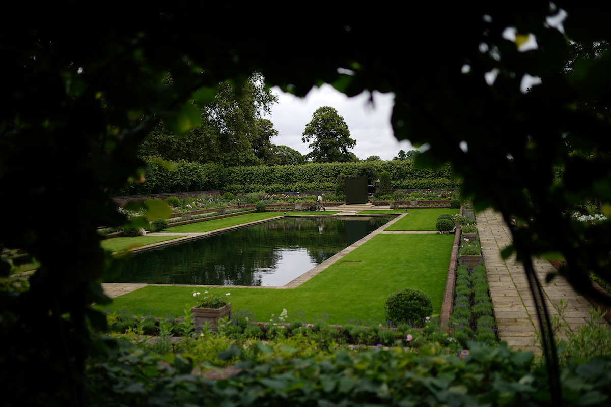 A gardener works in the Sunken Garden at Kensington Palace, London, the former home of Diana, Princess of Wales, where her sons, the Duke of Cambridge and the Duke of Sussex, will put their differences aside when they unveil a statue in her memory on what would have been her 60th birthday.