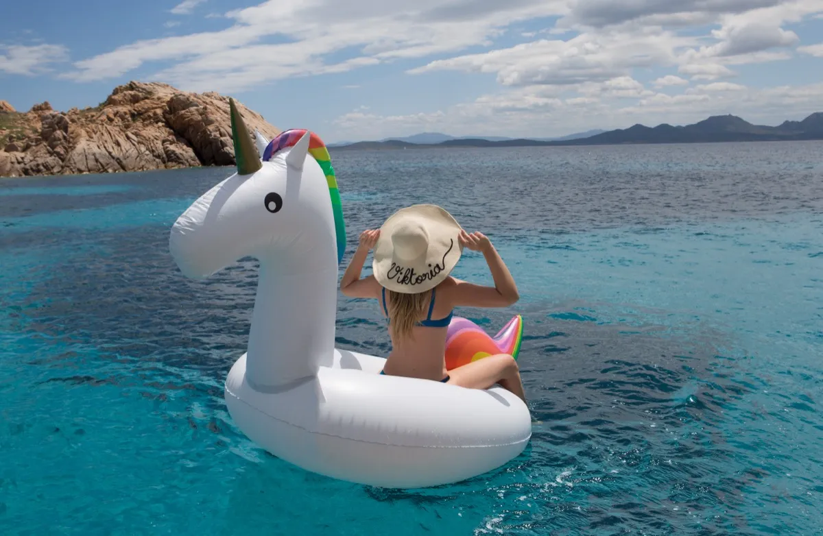 Woman on unicorn float