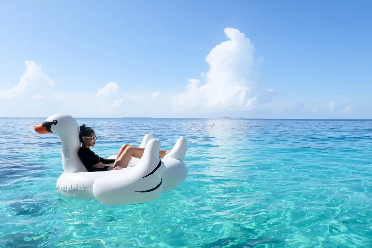 Woman on swan float
