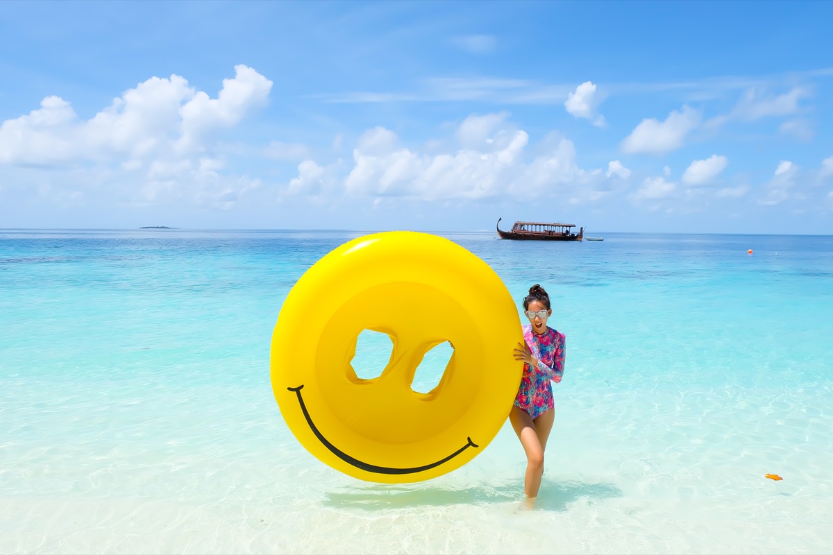 Woman with a smiley float