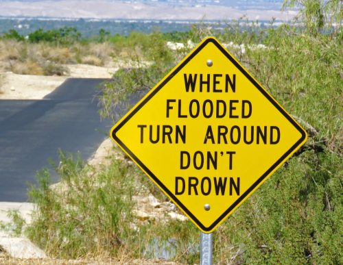 warning sign indicating the presence of flood water
