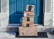 multiple amazon boxes on a doorstep