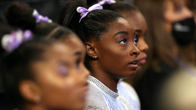 Simone Biles watches the competition prior to competing on the uneven bars during the Senior Women's competition of the 2021 U.S. Gymnastics Championships at Dickies Arena on June 04, 2021 in Fort Worth, Texas.
