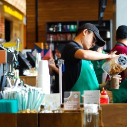SEREMBAN,MALAYSIA - SEPTEMBER 18, 201T: Worker at Starbucks Cafe preparing coffee for customers.Starbucks is an American global coffee company and coffeehouse chain based in Seattle, Washington