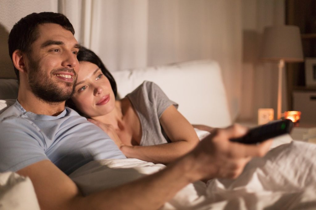 Couple watching TV before bed