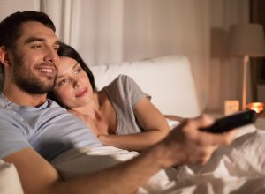 Couple watching TV before bed