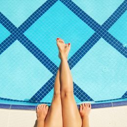 woman sitting by pool