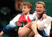 Bela Karolyi carrying Kerri Strug at the 1996 Olympics