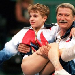 Bela Karolyi carrying Kerri Strug at the 1996 Olympics