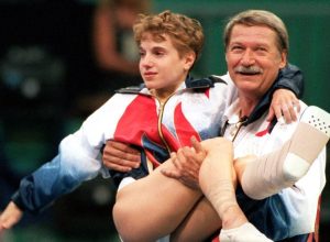 Bela Karolyi carrying Kerri Strug at the 1996 Olympics