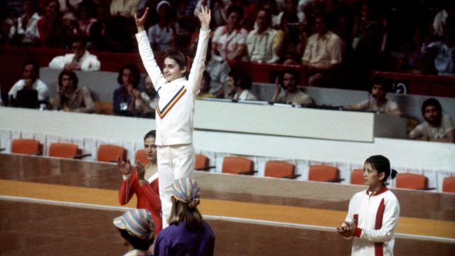 Nadia Comăneci on the medal podium at the 1976 Olympics