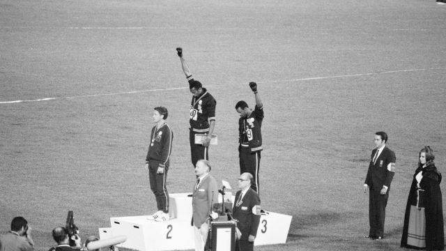 Tommie Smith, John Carlos, and Peter Norman on the medal podium at the 1968 Olympics