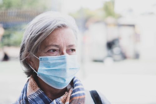 Older woman wearing a mask