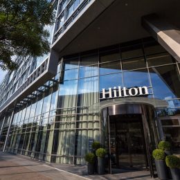 BELGRADE, SERBIA - AUGUST 14, 2018: Hilton logo on the entrance their newly opened hotel of Belgrade, during the afternoon. Hilton is one of the biggest brands of luxury hotels
