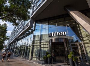 BELGRADE, SERBIA - AUGUST 14, 2018: Hilton logo on the entrance their newly opened hotel of Belgrade, during the afternoon. Hilton is one of the biggest brands of luxury hotels