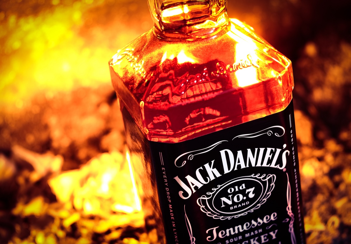 Jack Daniel's bottle in front of fire