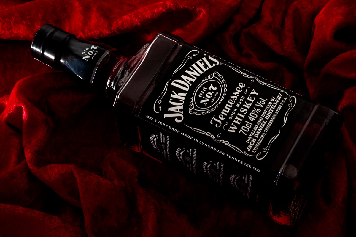 Jack Daniel's bottle and velvet backgroun