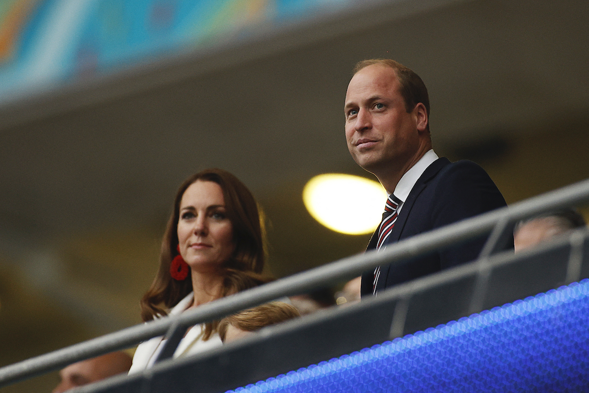 Prince William (R), Duke of Cambridge, and Catherine, Duchess of Cambridge, take their seats ahead of the UEFA EURO 2020 final football match between Italy and England at the Wembley Stadium in London on July 11, 2021.