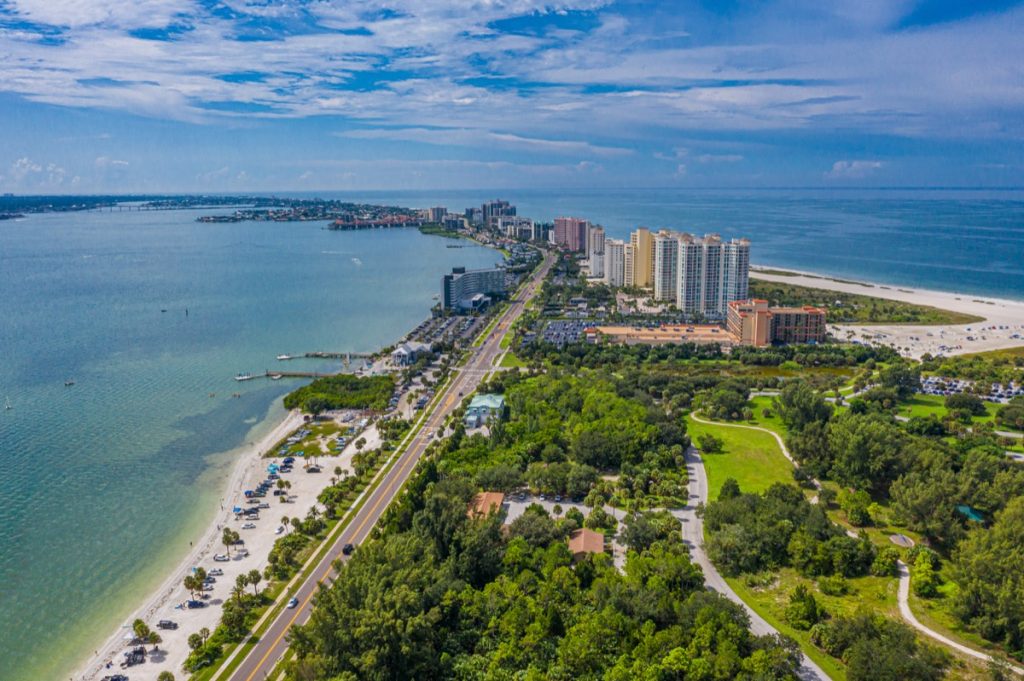 Aerial drone photo of beach and condos near St. Petersburg and Clearwater Beach, Florida.