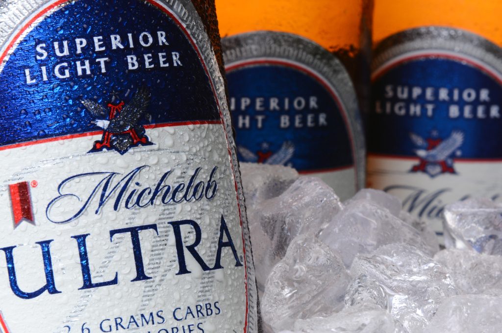 Closeup of Michelob Ultra bottles in ice. Introduced in 2002 Michelob Ultra is a light beer with reduced calories and carbohydrates, from Anheuser-Busch.