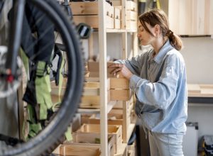 woman looking through stuff she's left in garage