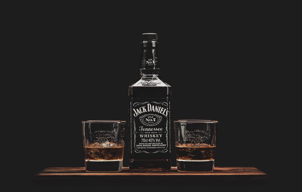 Two glasses and a bottle of Jack Daniel's