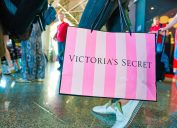 MOSCOW, RUSSIA - CIRCA AUGUST, 2018: a woman stand with Victoria's secret branded shopping bag in Vnukovo International Airport