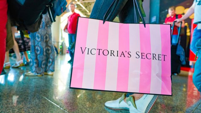 MOSCOW, RUSSIA - CIRCA AUGUST, 2018: a woman stand with Victoria's secret branded shopping bag in Vnukovo International Airport