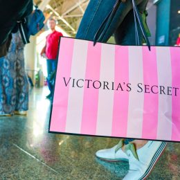 MOSCOW, RUSSIA - CIRCA AUGUST, 2018: a woman stand with Victoria's secret branded shopping bag in Vnukovo International Airport