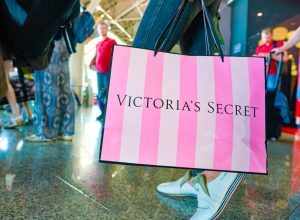 MOSCOW, RUSSIA - CIRCA AUGUST, 2018: a woman stand with Victoria's secret branded shopping bag in Vnukovo International Airport