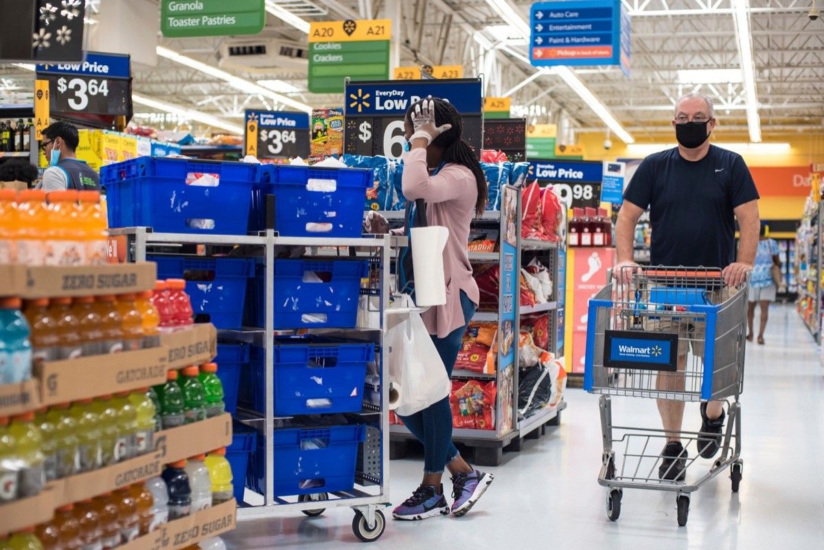 Walmart customer wearing face mask shopping