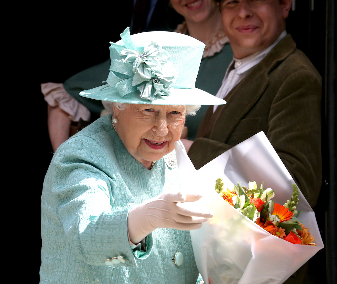 Queen Elizabeth visiting a replica of the original Sainsbury