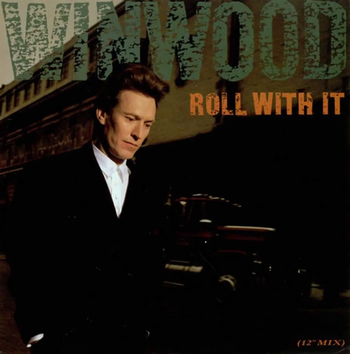 Steve Winwood "Roll With It" single cover