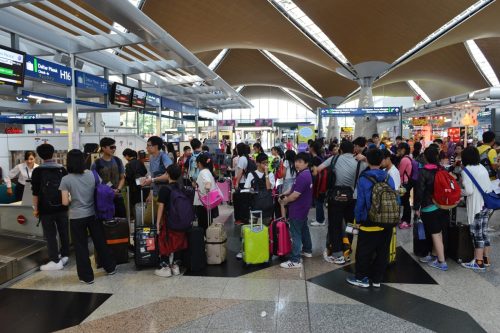 Airport terminal crowded with travelers