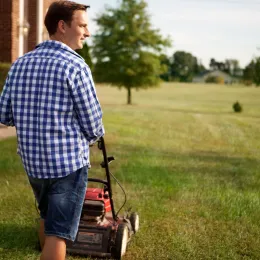 Man takes care of the garden around the house. At Virginia, USA.