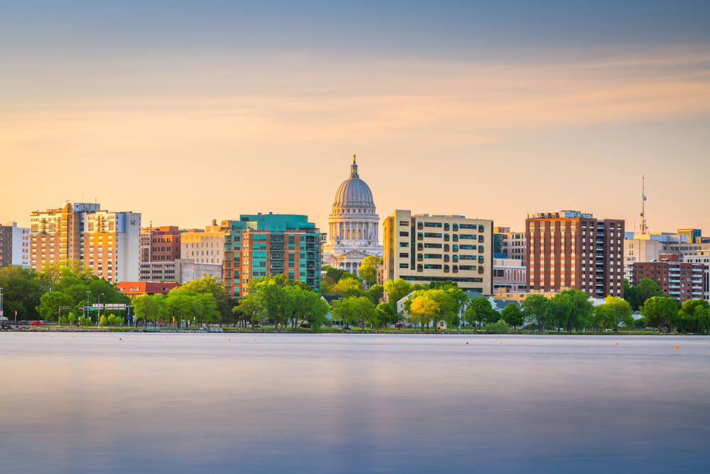The skyline of Madison, Wisconsin from the lake at dusk