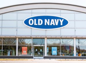 Bay Shore, New York, USA - 25 April 2020: The front of an Old Navy store in a strip mall empty due to the cdc rules during the coronavirus COVID-19 pandemic.