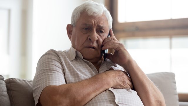 Man stressed on phone call