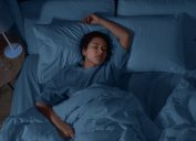 woman sleeping in bed at home at night